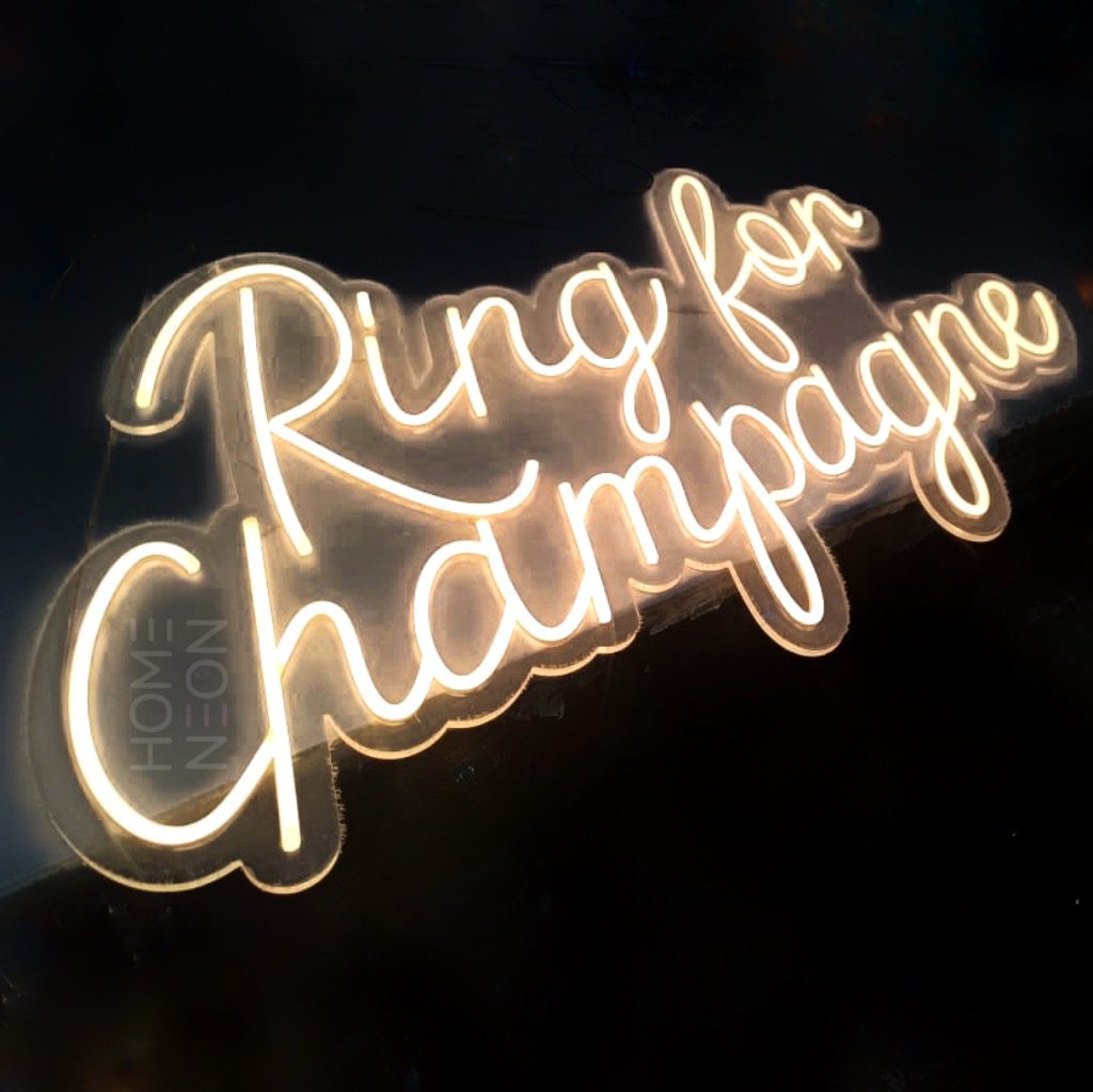 Неоновая вывеска с надписью Ring for champagne